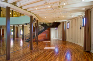 Flooring on the main level and mezzanine was created from reclaimed wood—an oak used in shipping containers.