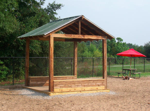 Mother Mathilda Beasley dog park shelter is composed of to-be-discarded materials, including timbers, flooring and metal roofing