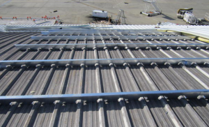 Sub-purlins were used for the metal-over-metal retrofit at this airport hangar. 