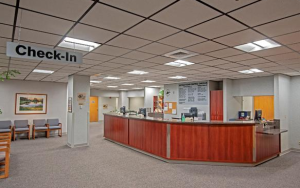 The clinic’s 75-watt halogen lamps were replaced with LR6 LED downlights that deliver ambient light and energy savings.