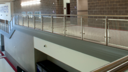 Lewisville High School's stairways and balconies now feature Banker Wire stainless-steel mesh.