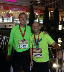 Publisher John Riester and Jason Waller (right) ran in the Rock-n-Roll Half Marathon in Las Vegas.