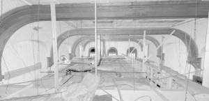 Scans of the space above the existing drop ceiling show the original arched windows and barrel-vaulted ceiling. Image: Dewberry