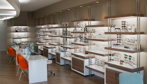 A custom LED strip lighting solution ensures eyeglasses and sunglasses are consistently illuminated throughout the display area.