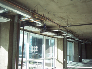 Heat losses would be reduced along the windows by using ACB50 active chilled beams mounted at the ceiling above the window with the air being discharged into the room
