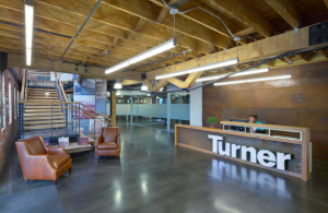 One-hundred-year-old structural white oak was salvaged during deconstruction and used to frame the project’s stair openings and treads and wheelchair lift, as well as compose the reception desk. PHOTO: Turner Construction 