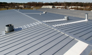 Here is an installed 238T recover over R-panel by Titan Roof that utilizes McElroy Metal’s transverse panels behind curbs to provide long term performance.