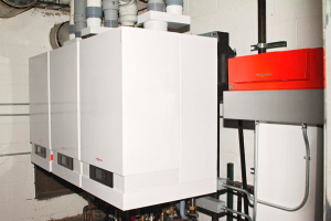 With only 11 by 7 feet of floor space in the boiler room, three small but powerful high-efficiency boilers were installed that meet the energy-load requirements.