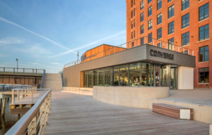 The transformation of the Hoffman Building from an anonymous industrial presence to an iconic urban landmark was enhanced by a second addition on the wharf itself, a 2-story music studio and public entertainment venue called Rubber Tracks.