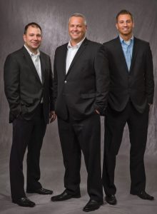 Noritz America announces Jay Hassel (center), new President and COO, with new VP of Sales & Marketing Jason Fleming (right) and new National Sales Manager Jason Corey.