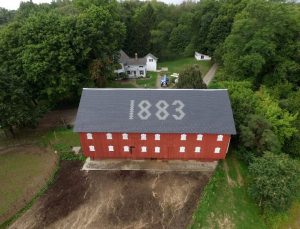 DaVinci slate tiles are used to retain the historic character of the barn, even to the point of recreating the date on the roof.