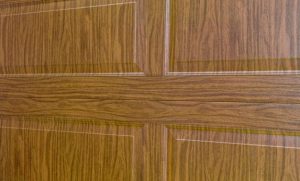 Garage door wood grain options from Haas Door replicate the appearance of real wood doors, but without the maintenance hassles of wood.