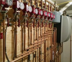 The installation of the boilers provides more consistent heat for residents of the apartment complexes.
