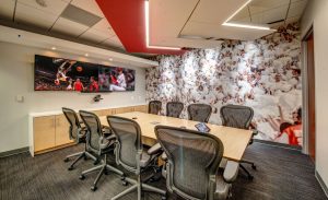 V Three Studios brings the college sports atmosphere to the Learfield headquarters renovation through televisions displaying sports programming, sports themed wallcoverings and recycled stadium seating.