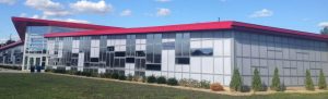 The LIGHTWALL 3000 curtain wall accepts both insulated glass units and cellular polycarbonate glazing panels in the same extruded aluminum framing system.