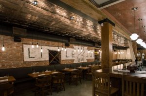 The concept for the Little Jumbo Restaurant is a 1920’s New York-style speakeasy with a wooden bar, exposed brick walls, old tiles in the washrooms, and a decorative ceiling.