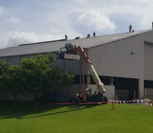Advanced Roofing uses its in-house crane division to lift their 238T roll former into place.