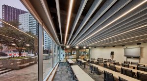 To mitigate reverberation issues and address the lighting needs in the first-floor training room and event space, Omniplan selects the Seem 1 Acoustic luminaire and baffle system.